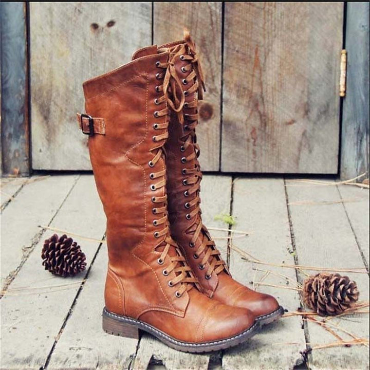 Bottes hautes jusqu'au genou pour femme en cuir avec laçage à l'avant