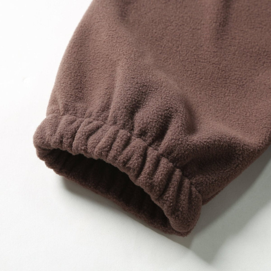 Pull polaire pour homme à fermeture zippée au quart avec motif à empiècements de couleurs