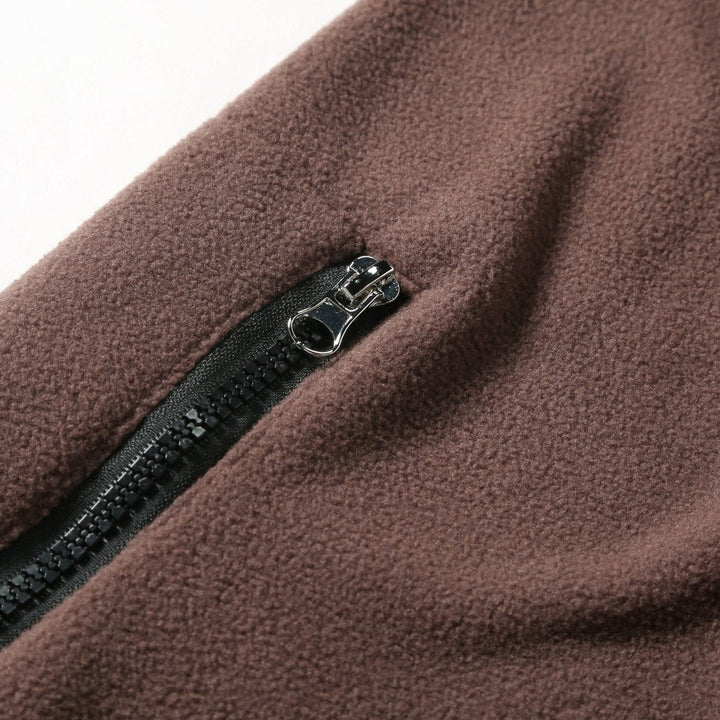 Pull polaire pour homme à fermeture zippée au quart avec motif à empiècements de couleurs